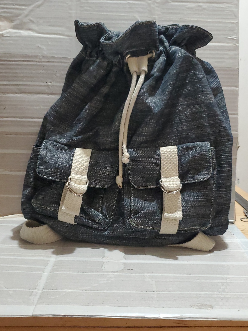 Denim-Look Drawstring Backpack with Cream Strap Details - Picture 2 of 12